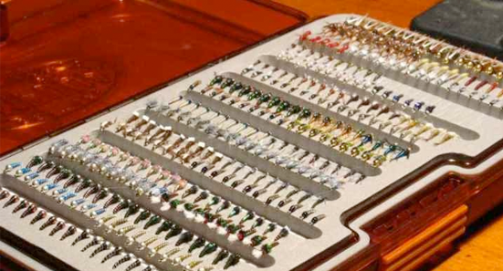 Fly boxes are made strong using a variety of light weight materials to protect, hold and store fly fishing flies.